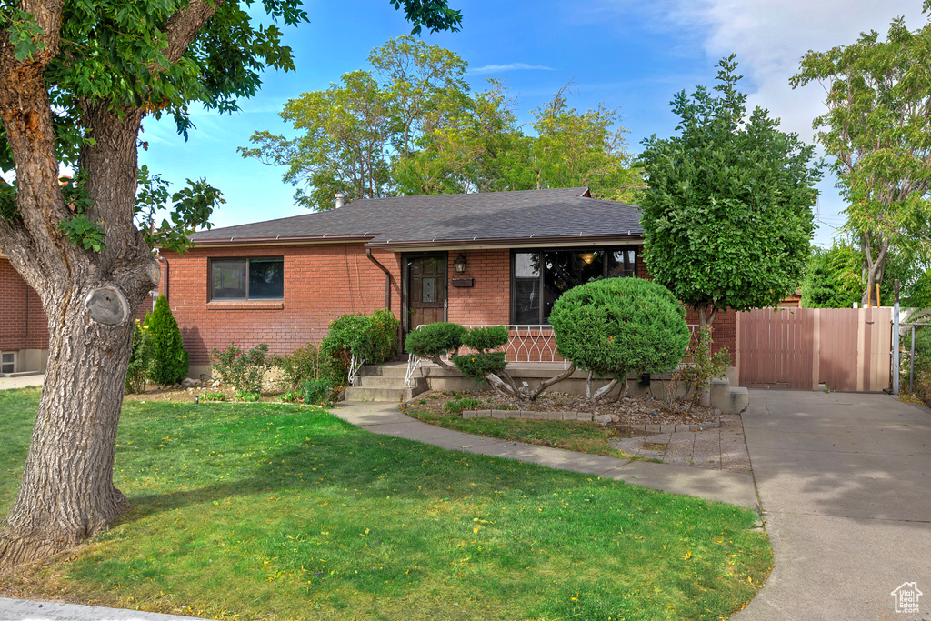 View of front of property with a front lawn