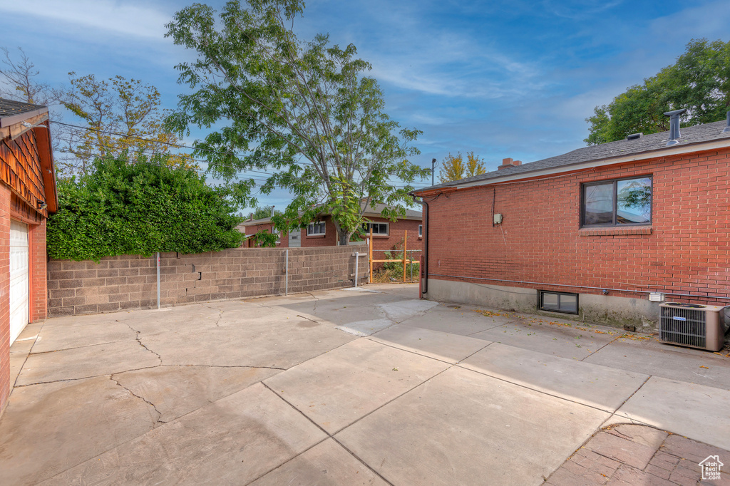 View of patio with central AC unit