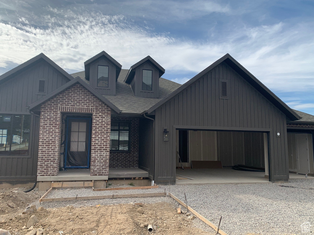 View of front of property featuring a garage