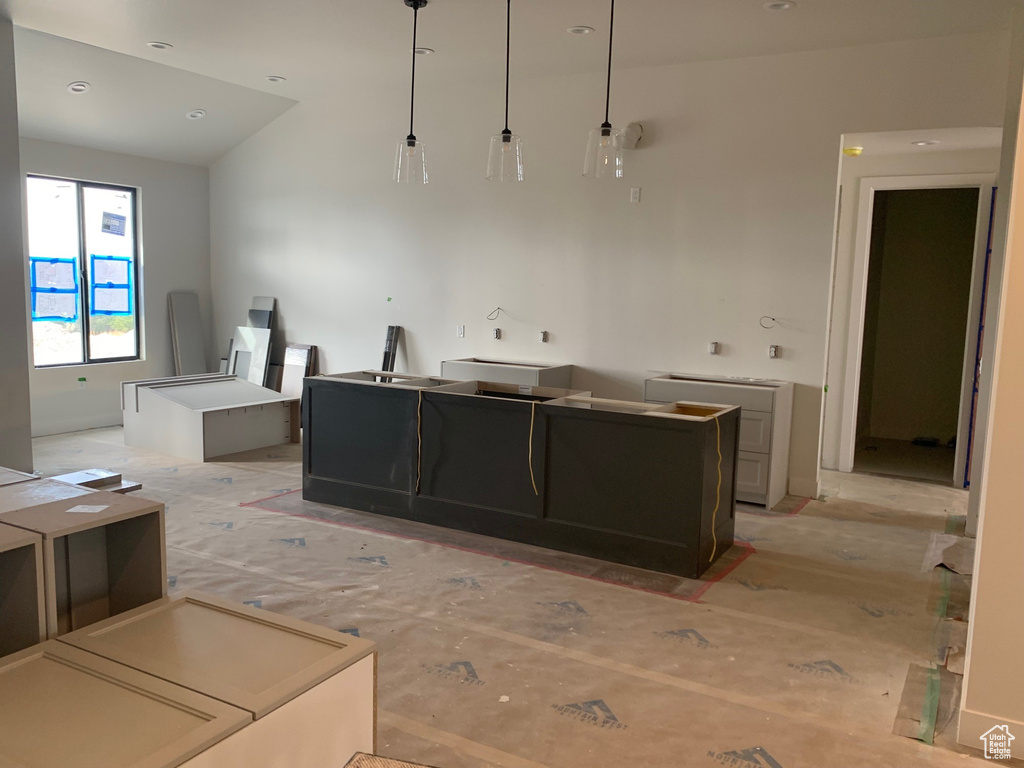 Kitchen featuring pendant lighting and a center island