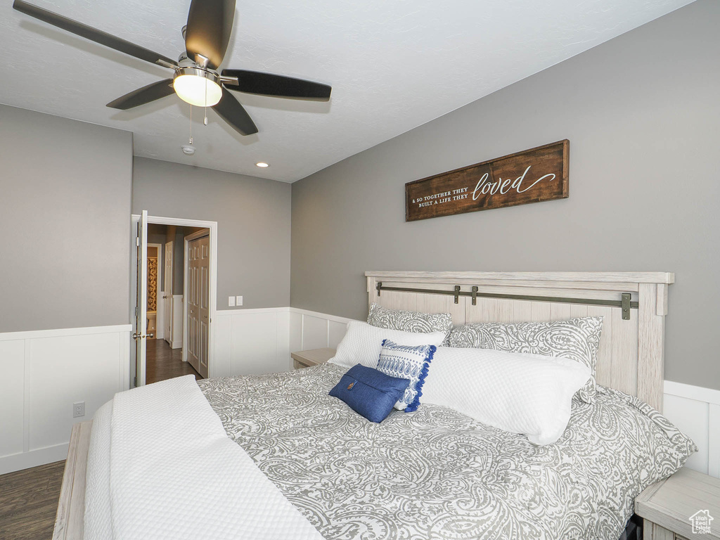 Bedroom featuring dark hardwood / wood-style flooring and ceiling fan