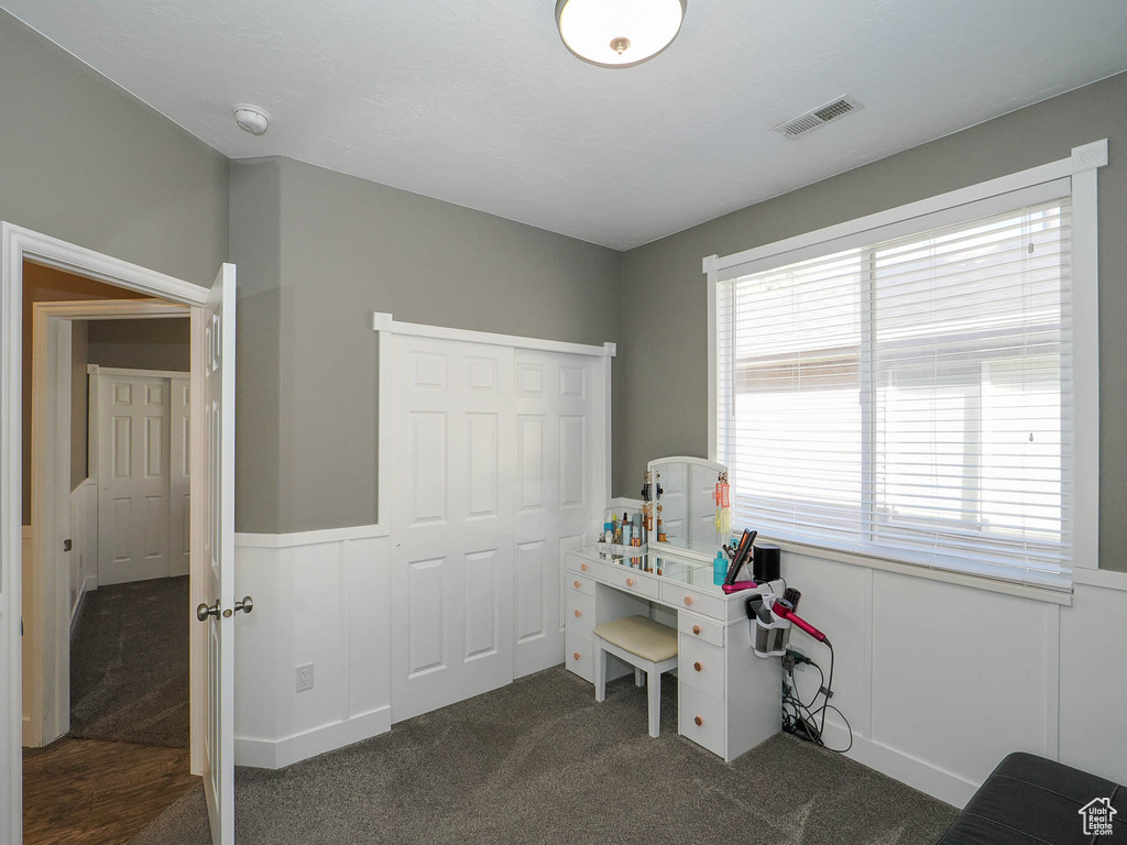 Recreation room with dark colored carpet