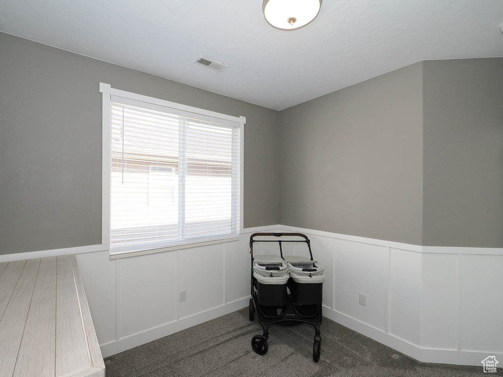 Miscellaneous room featuring dark carpet