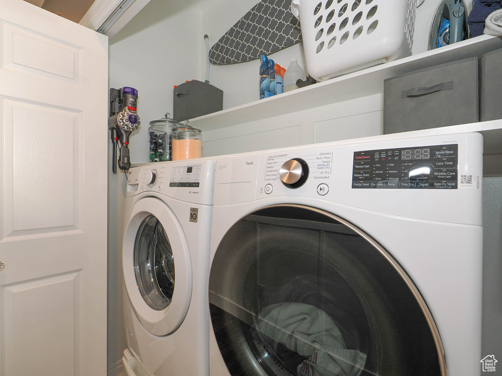 Washroom featuring washer and clothes dryer