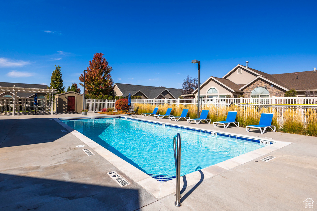 View of swimming pool featuring a patio