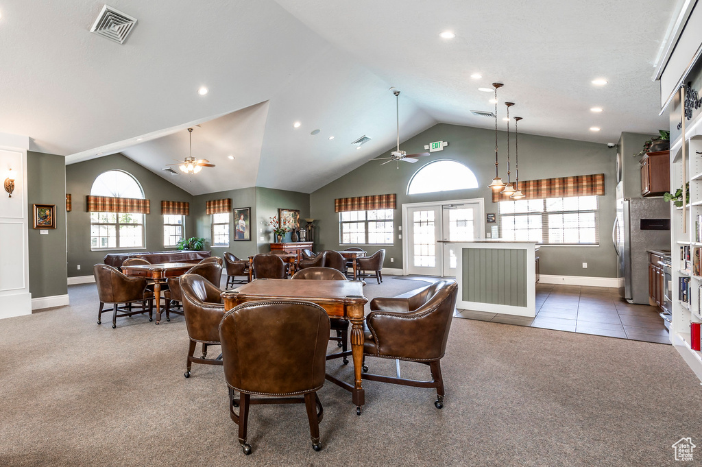 Dining room featuring carpet floors, ceiling fan, and plenty of natural light