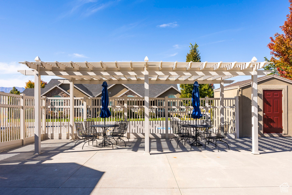 View of patio / terrace featuring a storage shed and a pergola