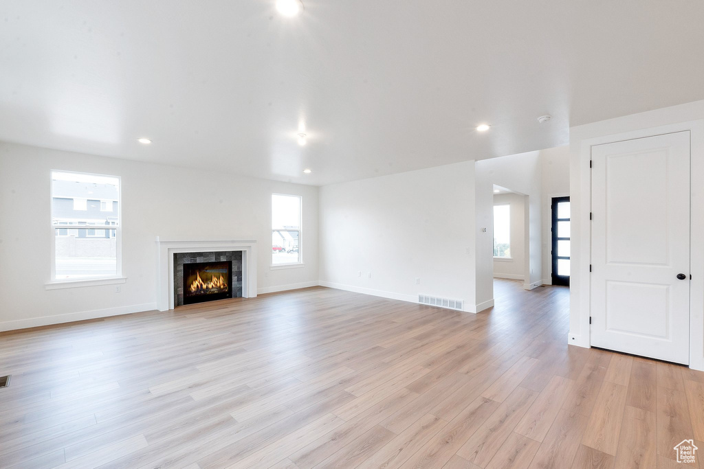 Unfurnished living room featuring light hardwood / wood-style flooring