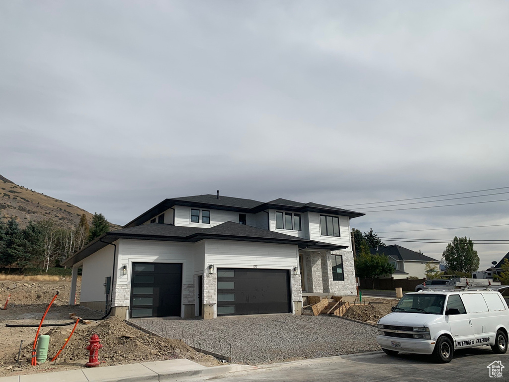 View of front of house with a mountain view