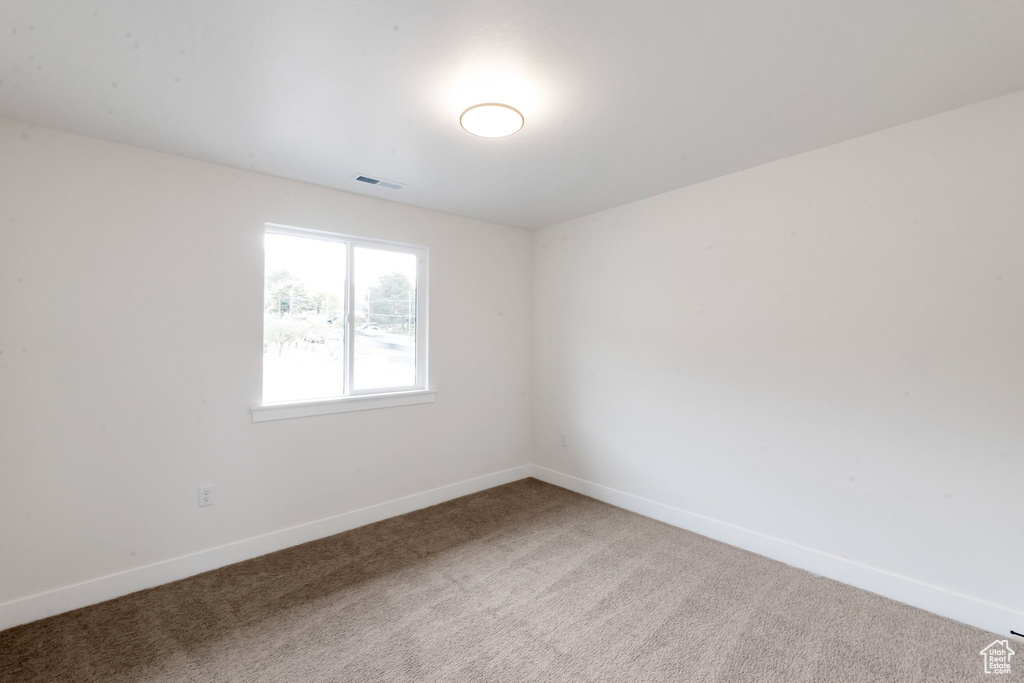 View of carpeted spare room