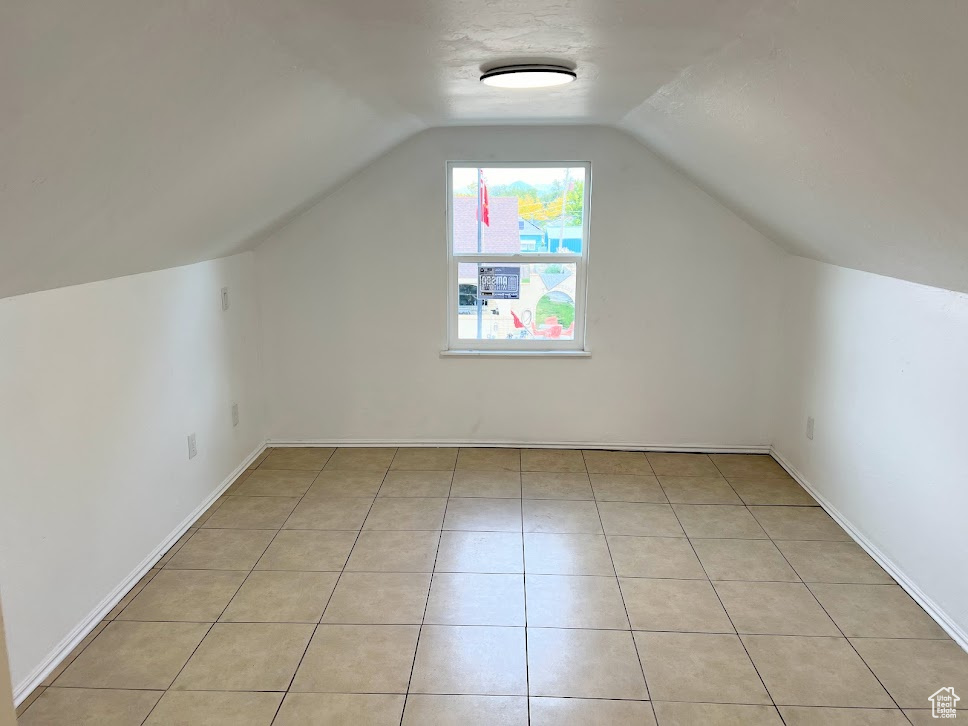 Bonus room featuring vaulted ceiling