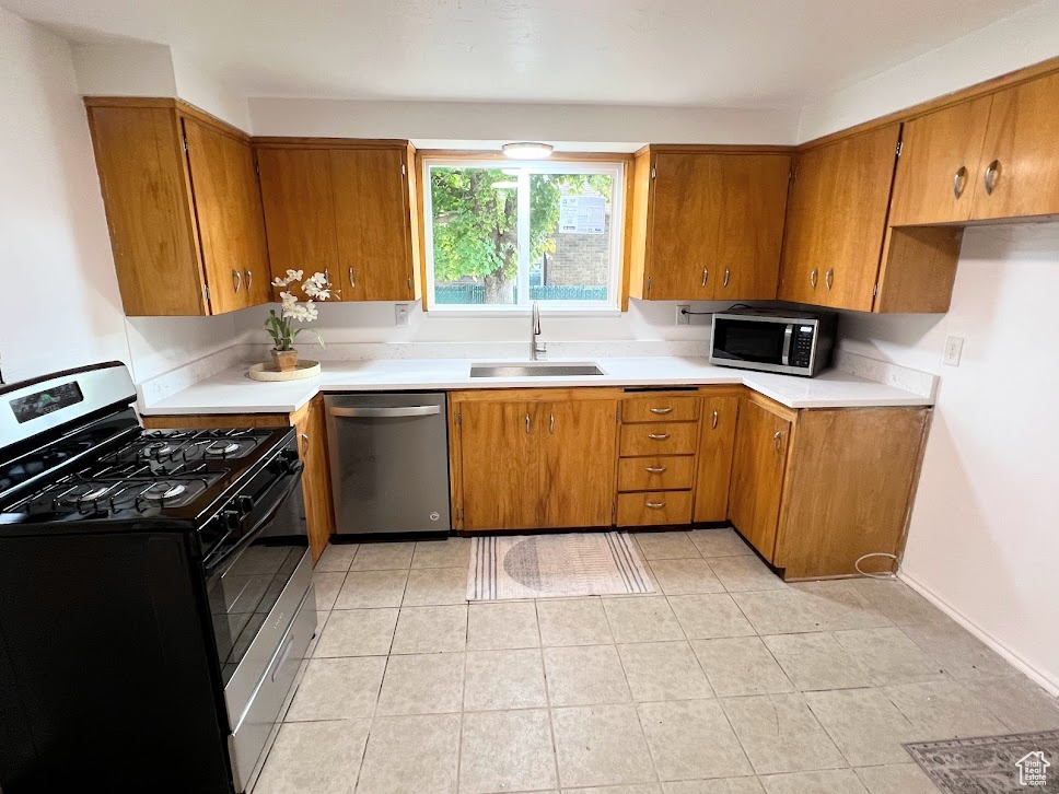 Kitchen with stainless steel appliances and sink