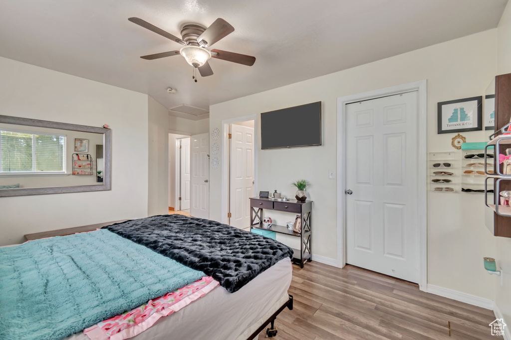 Bedroom with light wood-type flooring and ceiling fan