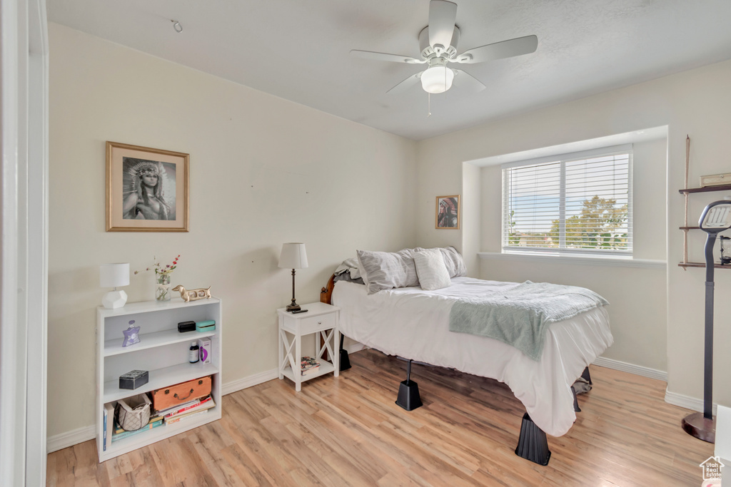 Bedroom with light wood-type flooring and ceiling fan