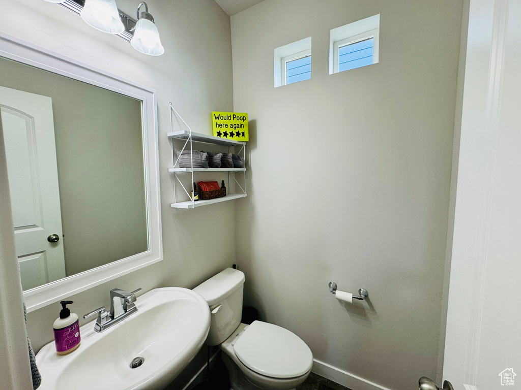 Bathroom featuring sink and toilet