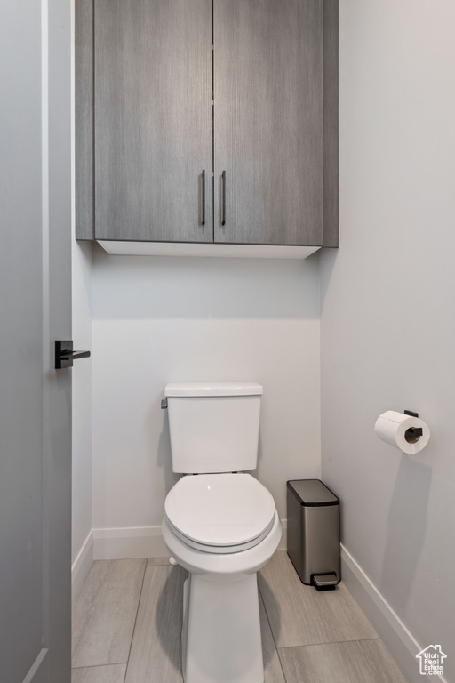 Bathroom with tile patterned flooring and toilet