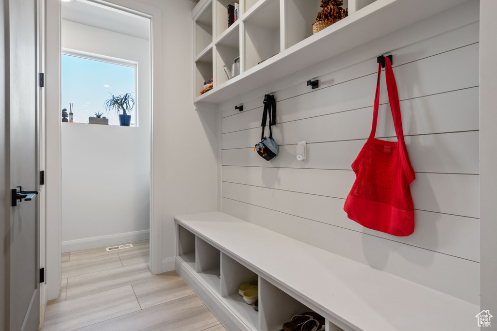 Mudroom with light wood-type flooring