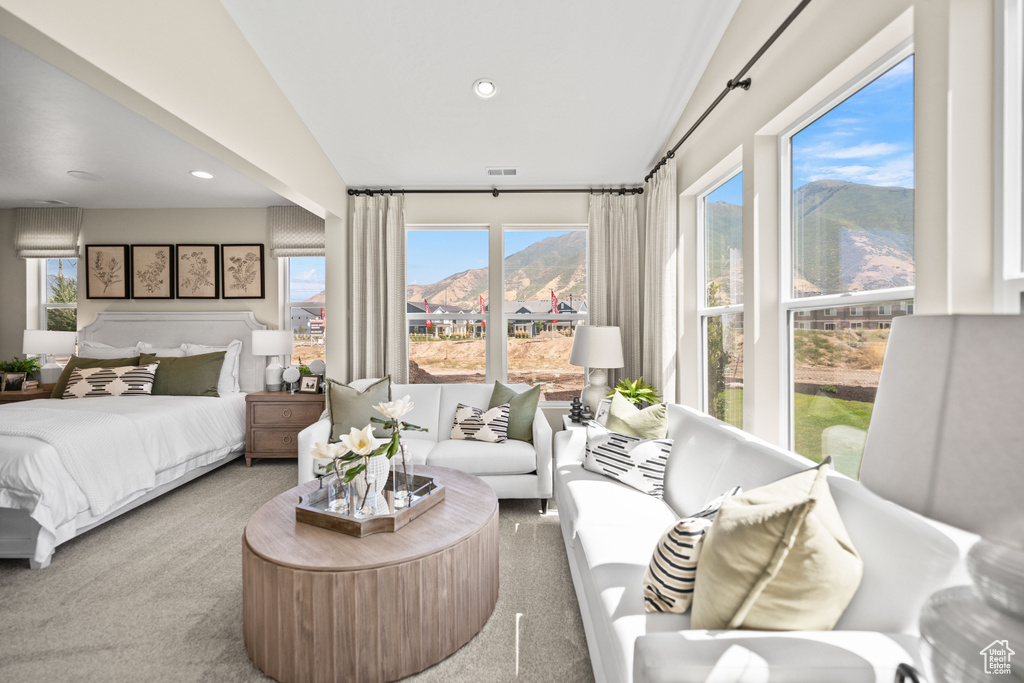 Carpeted bedroom with lofted ceiling and a mountain view