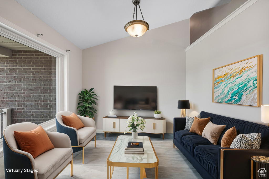 Living room featuring vaulted ceiling