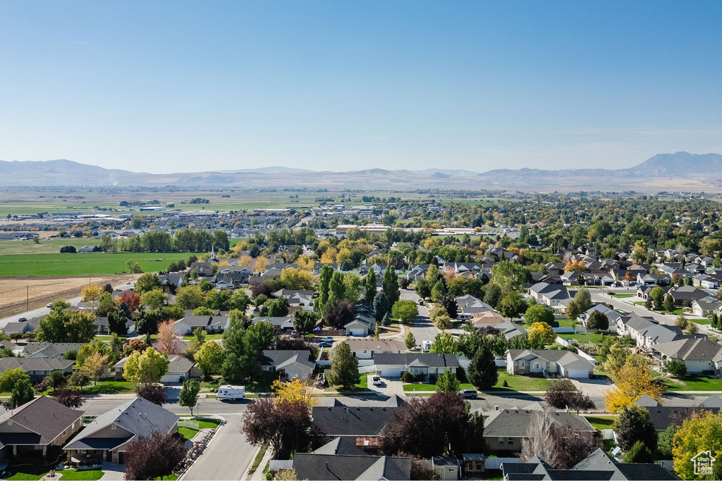 Birds eye view of property with a mountain view