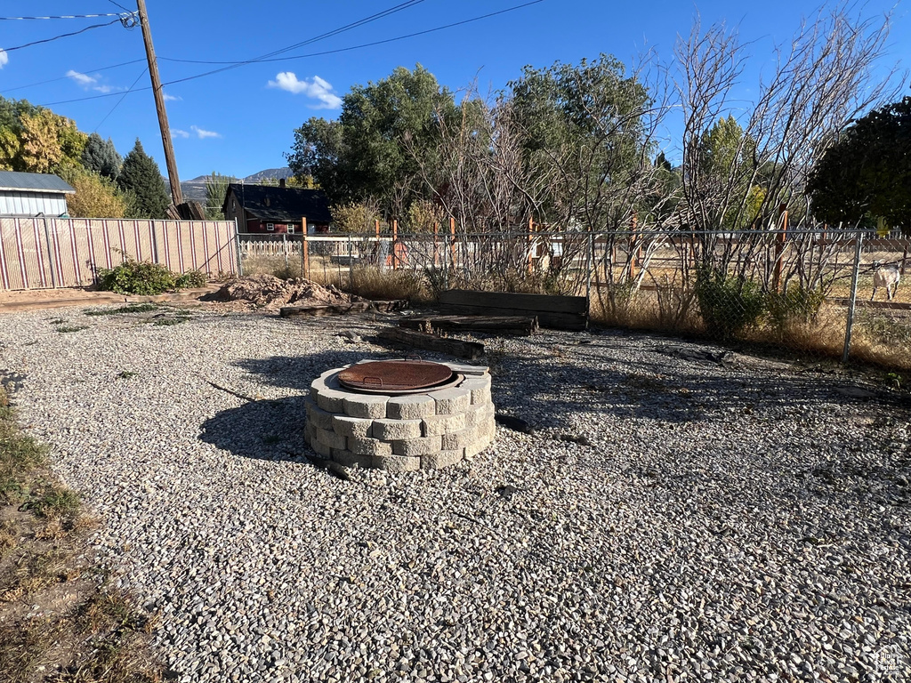 View of yard with a fire pit