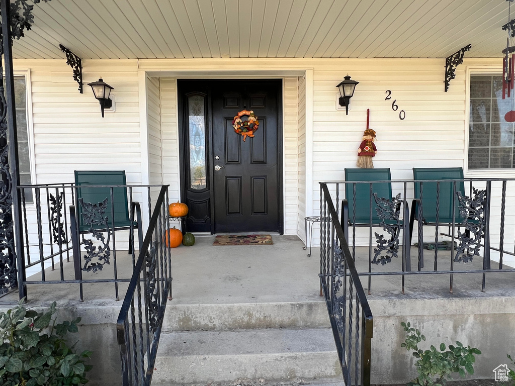 Entrance to property with a porch