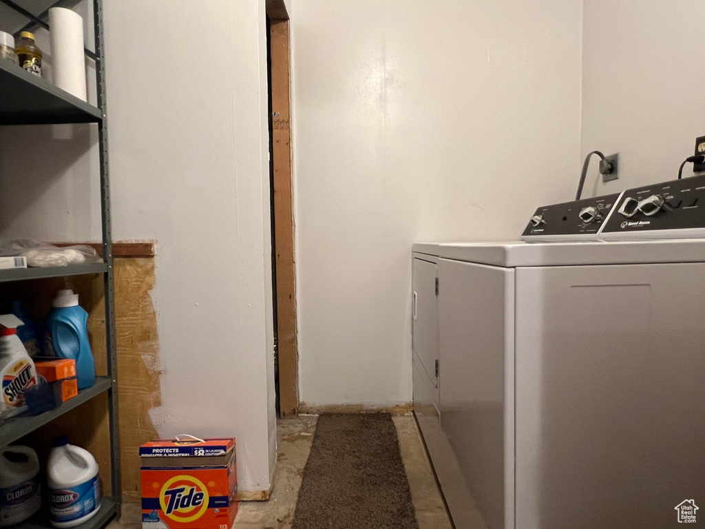 Laundry room featuring washing machine and clothes dryer