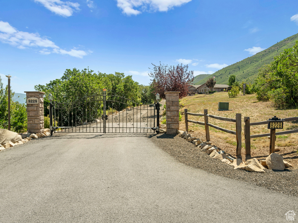 View of gate featuring a mountain view