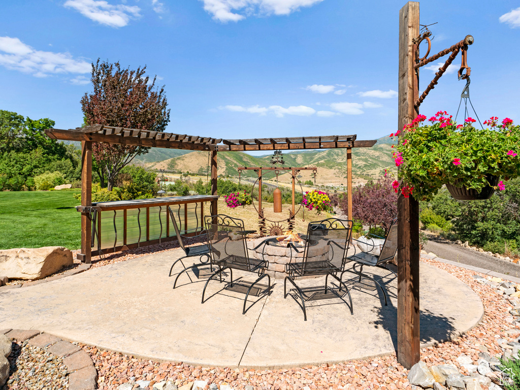 View of patio with a mountain view