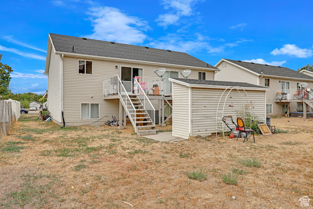 Rear view of house with a wooden deck