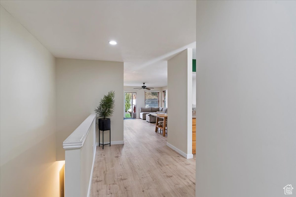 Corridor with light hardwood / wood-style floors