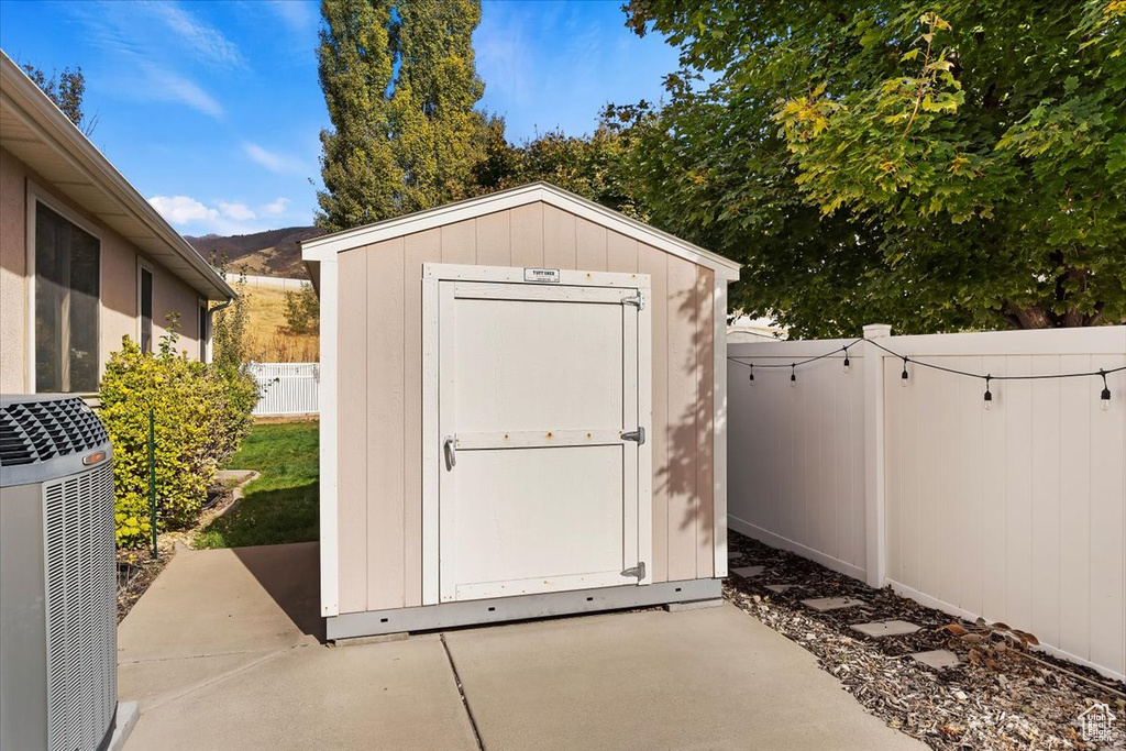 View of outbuilding with a mountain view and cooling unit