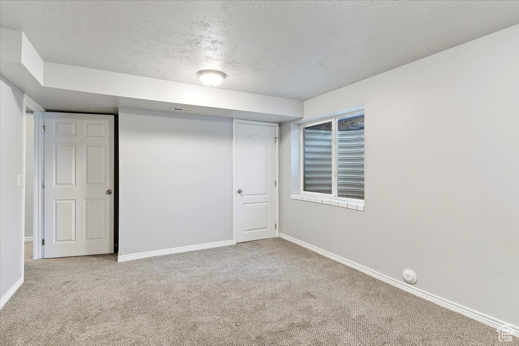 Interior space featuring a textured ceiling