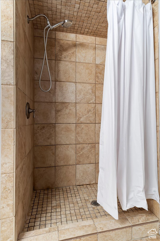 Bathroom featuring a shower with shower curtain