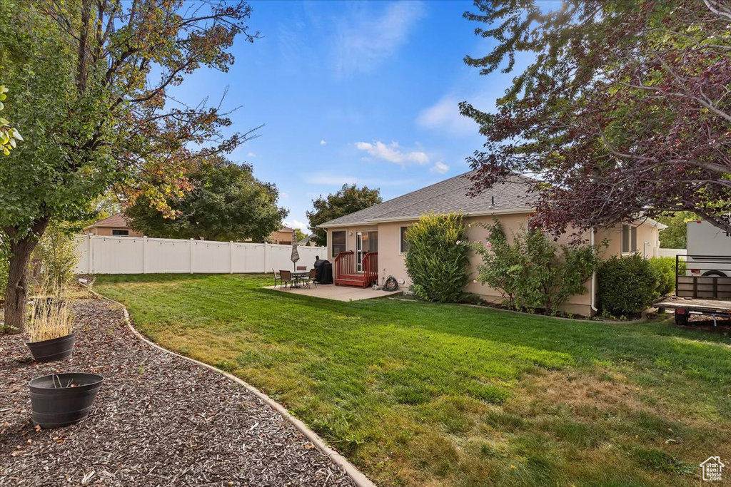 View of yard with a patio