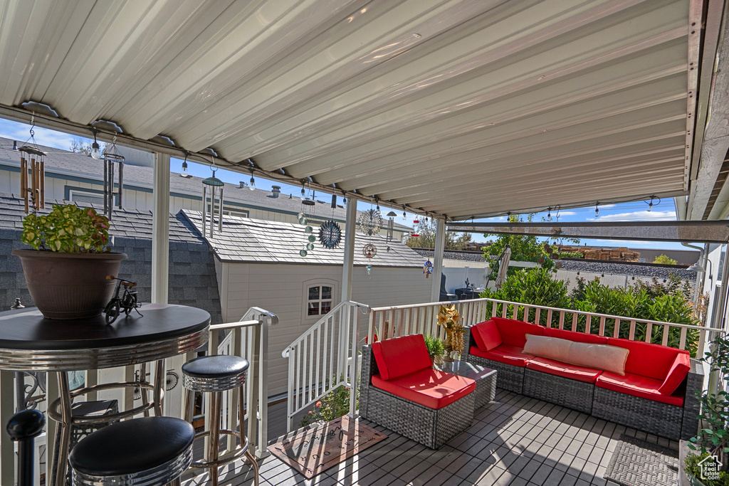 Wooden deck with an outdoor living space