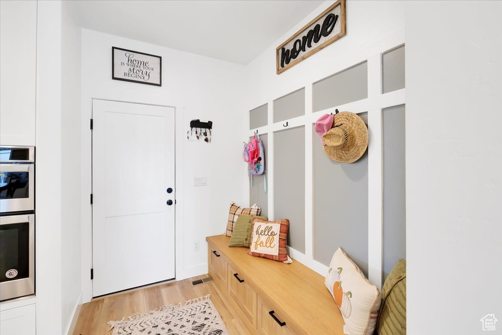 Mudroom featuring light hardwood / wood-style flooring