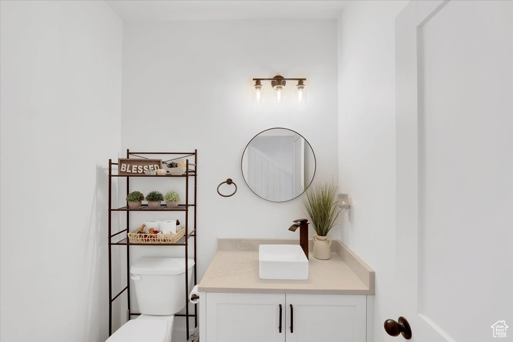 Bathroom featuring vanity and toilet