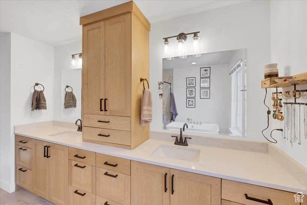 Bathroom featuring vanity and plus walk in shower