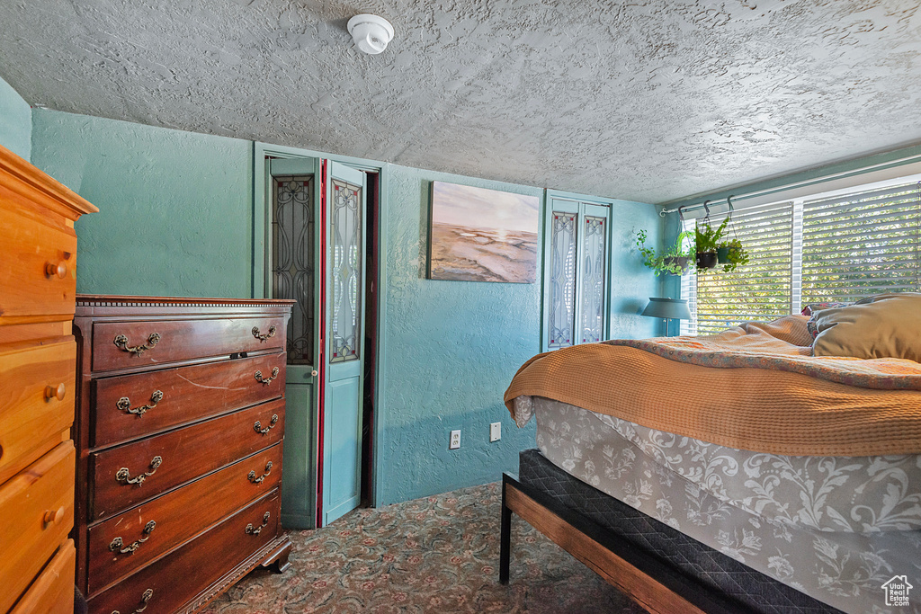 Bedroom featuring a textured ceiling