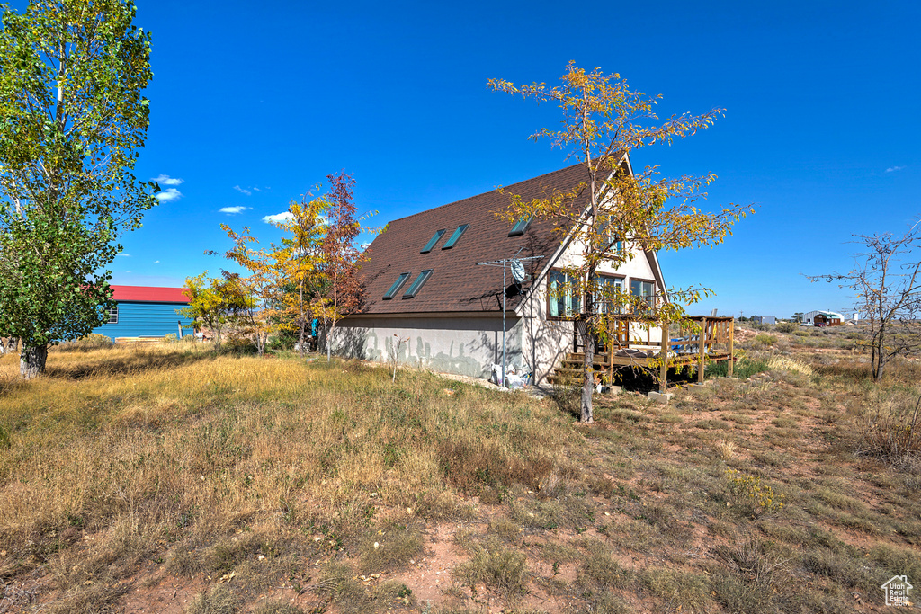 Exterior space with a deck with water view