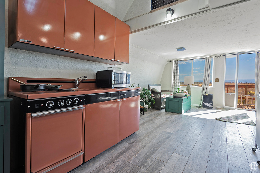 Kitchen featuring stainless steel appliances and light wood-type flooring