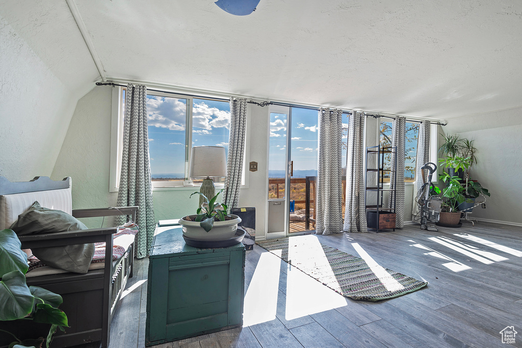 Living room featuring a water view and hardwood / wood-style flooring