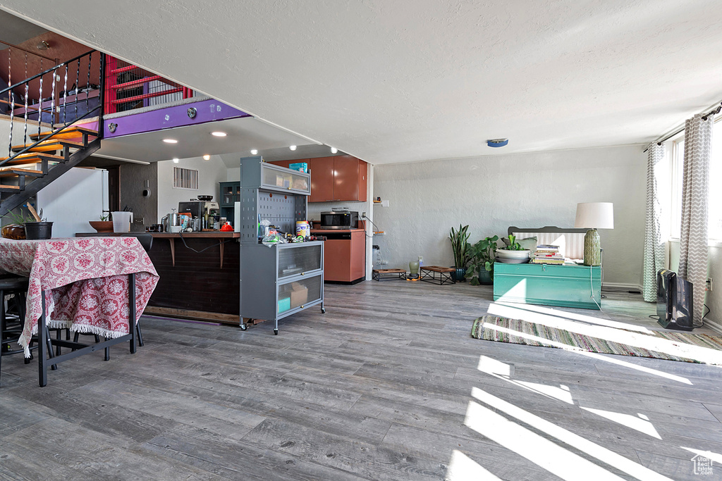 Living room with hardwood / wood-style flooring