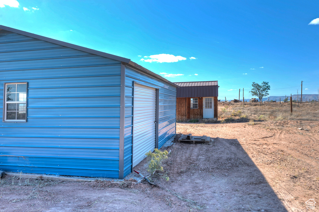 Exterior space featuring an outbuilding