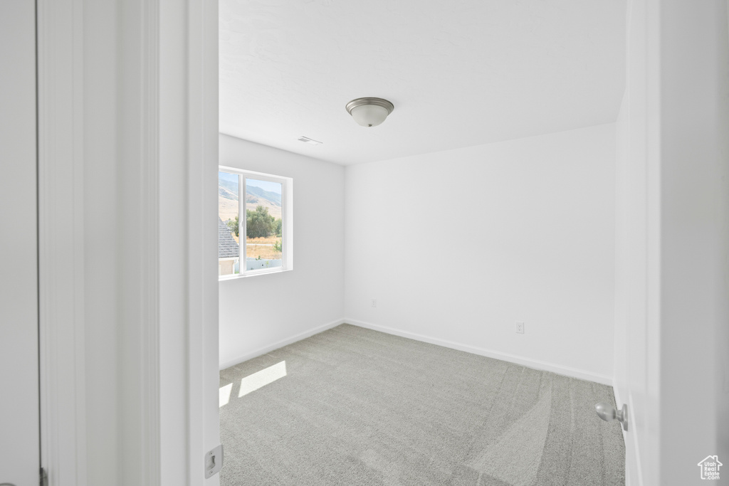 Unfurnished room featuring carpet floors