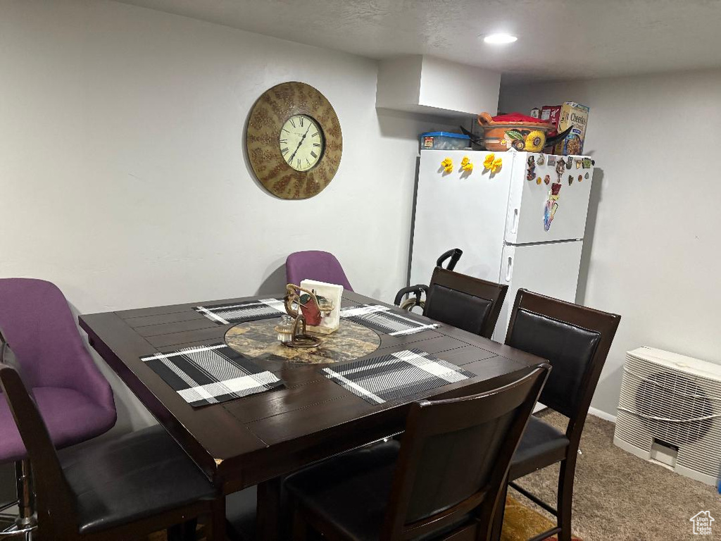 View of carpeted dining space