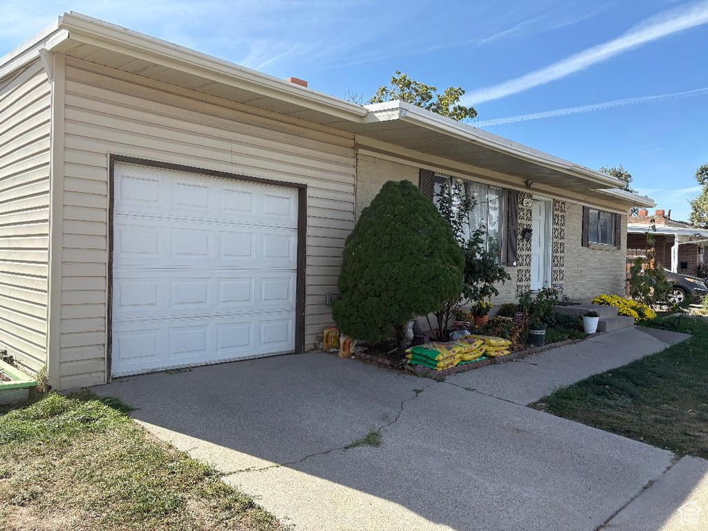 Single story home featuring a garage