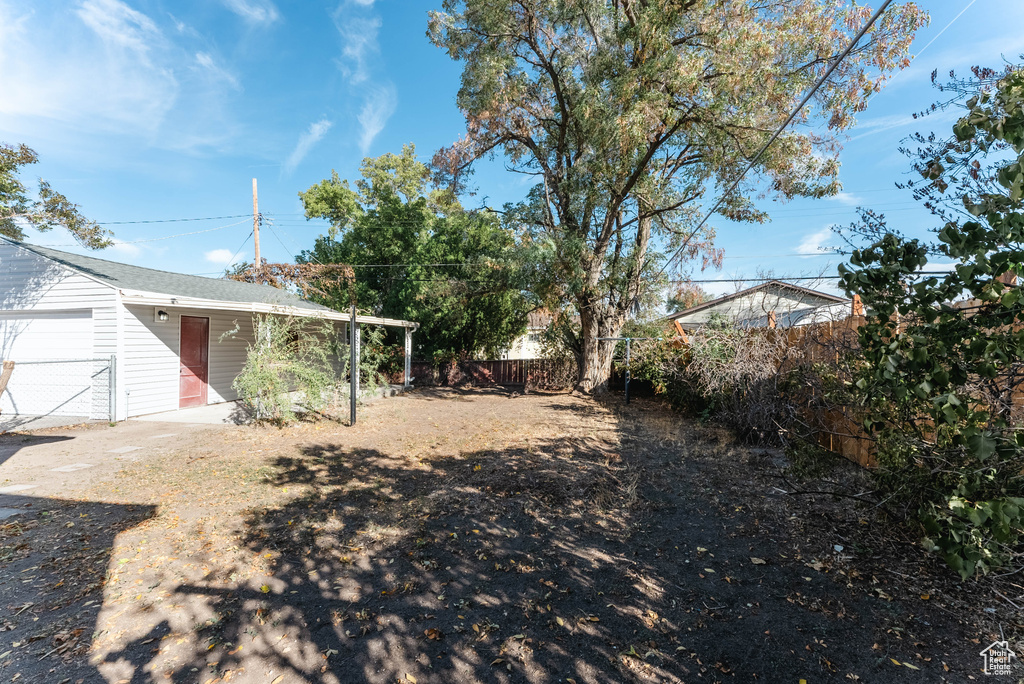 View of yard with a garage