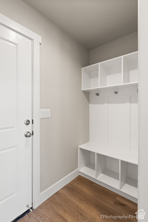 Mudroom with hardwood / wood-style flooring